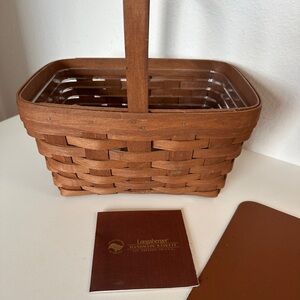 Longaberger Brown Woven Basket with plastic liner.